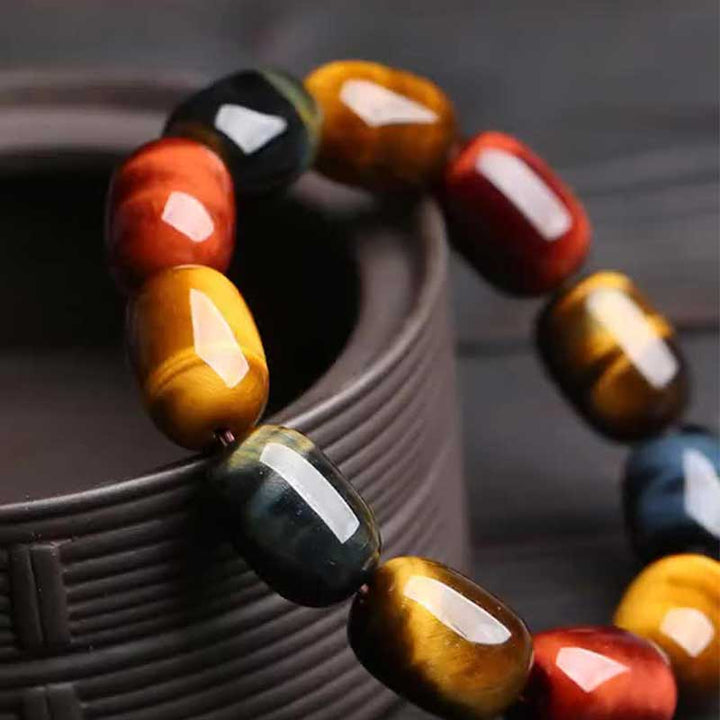 Armband Tigerauge Schutz Heilung bunte Perlen rot blau gelb Handgelenk