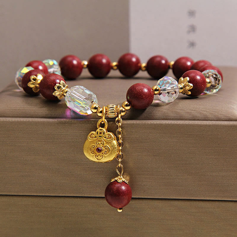 Armband Sandelholz Glück Heilung rote Perlen Kristall goldener Anhänger Handgelenk