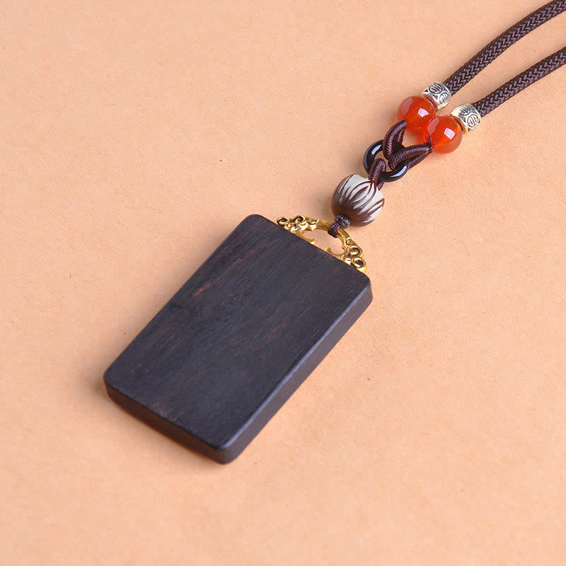 Schwarze Ebenholz Kette mit roten Perlen Kupfermünze Anhänger