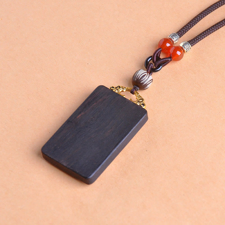 Schwarze Ebenholz Kette mit roten Perlen Kupfermünze Anhänger