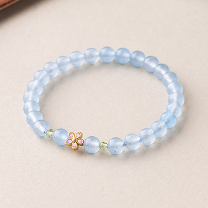 Armband Aquamarin Kupfer Blume Heilung blaue Perlen zartes Schmuckstück Handgelenk