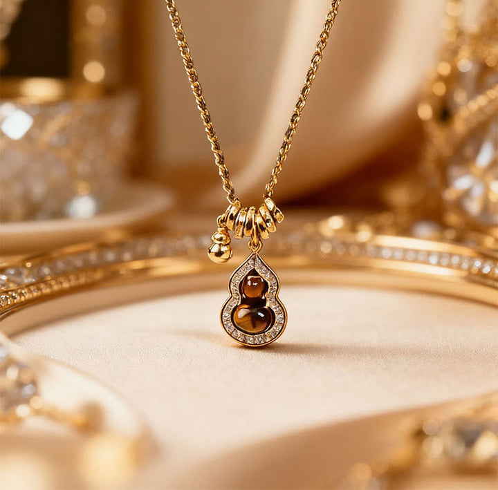 Goldene Kette mit Tigerauge Doppelkürbis Anhänger Kupfer Stärke Energie