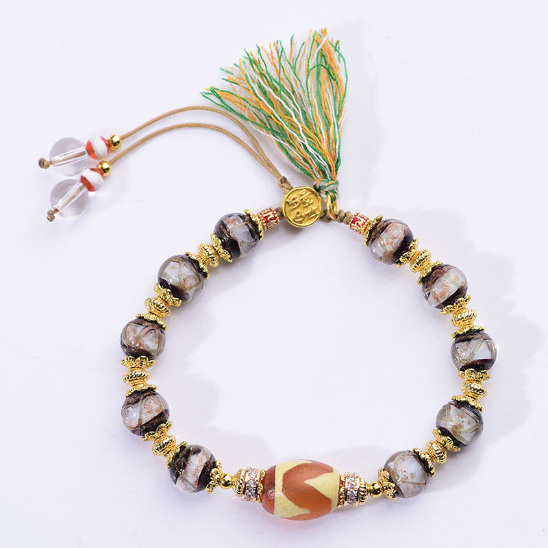 Armband Liuli – Segen mit Glasperlen Dzi Perle goldene Akzente Quaste Handgelenk