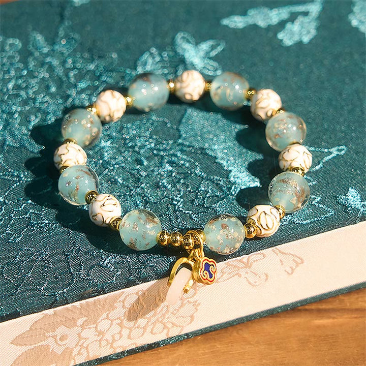 Armband Liuli – Segen Energie türkis Glasperlen Lotus Anhänger Handgelenk Schmuck