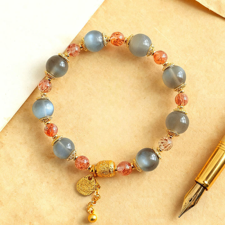 Armband Erdbeerquarz Mondstein Mond Heilung Positivität Perlen Goldakzente Schreibfeder