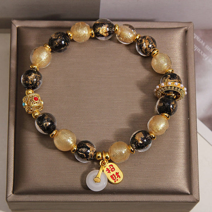Armband Liuli – Wohlstand & Frieden mit goldenen schwarzen Glasperlen Jade Anhänger