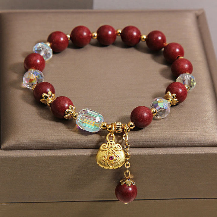 Armband Sandelholz Glück Heilung rote Perlen Kristall goldener Anhänger Schmuckbox