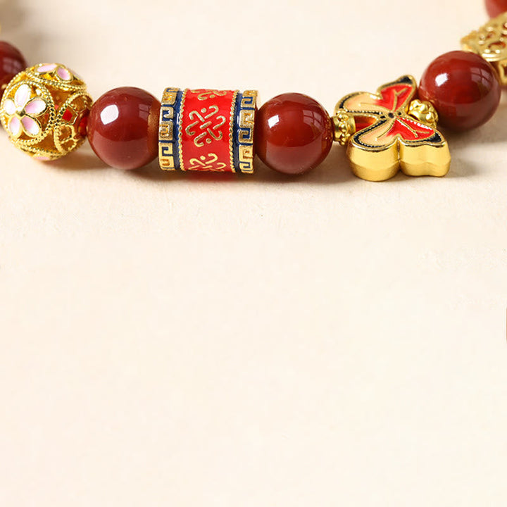 Armband Turmalin Roter Achat – Erfolg mit goldenem Schmetterling Detailansicht