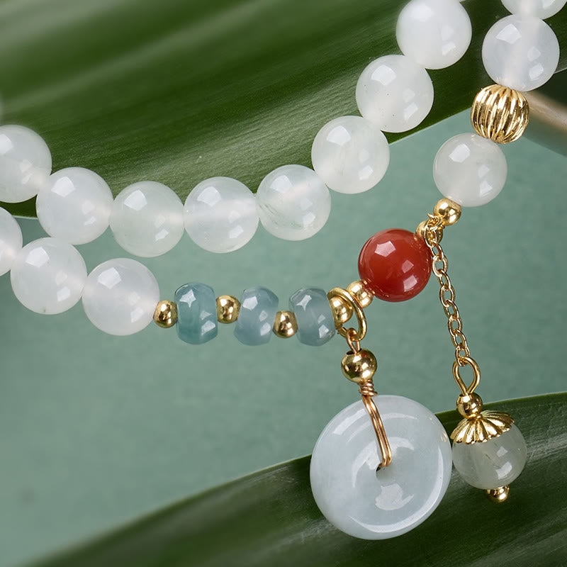 Armband Jade Achat Glück & Fülle weiße Perlen Anhänger auf Blatt