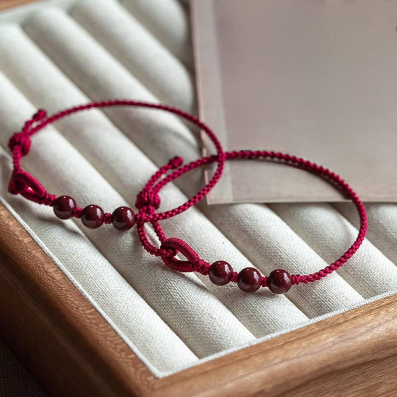 Armband Zinnober – Segen & Ruhe rotes geflochtenes Glücksband mit Zinnoberperlen