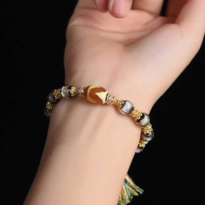 Armband Liuli – Segen am Handgelenk getragen Dzi Perle Glücksbringer Schutz