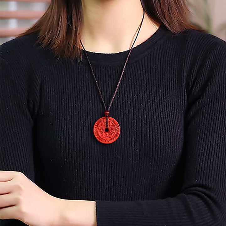 Zinnober Berggeist Kette mit Bagua Symbol rot Naturstein elegant getragen