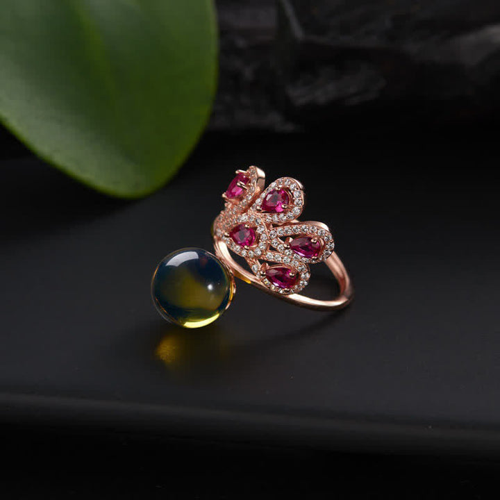 Ring Bernstein Pfau Glück Liebe Rubinen Gold eleganter Schmuck