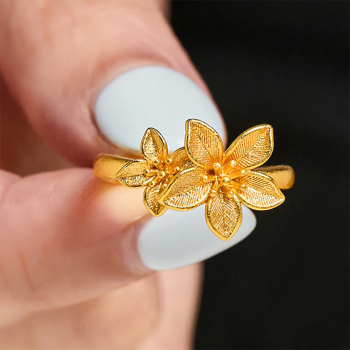 Vergoldetes Kupfermessing Ring mit Lila Blüte Steinen elegant Schmuck getragen