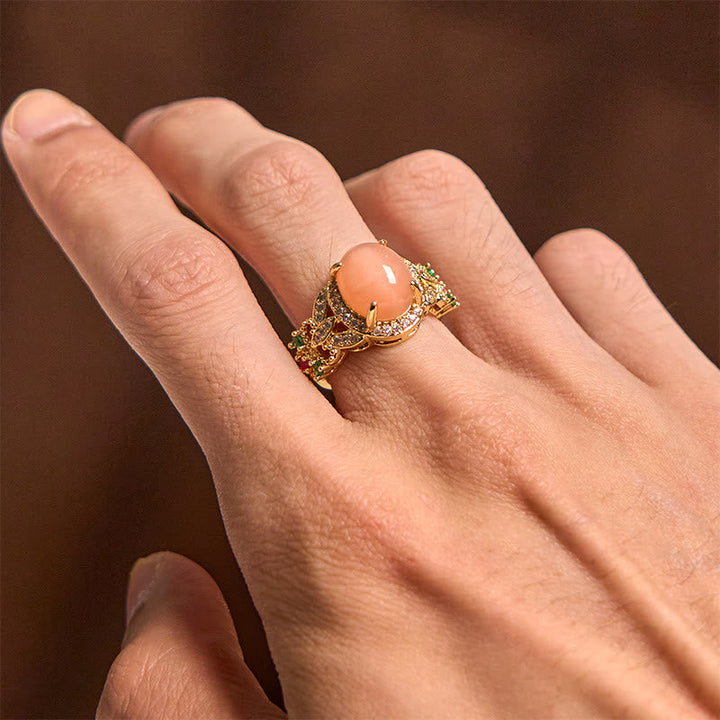 Pfirsichmondstein Ring getragen Gold Glücksblume Ruhe Schutzring Hand