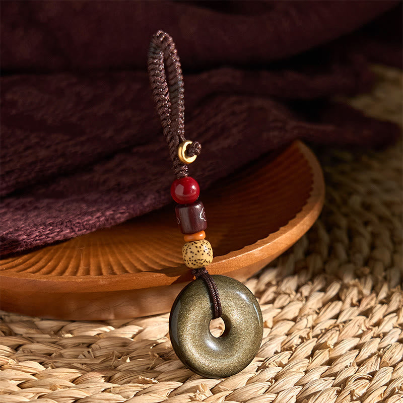 Schlüsselanhänger Goldobsidian Friedensschnalle handgeknüpft Holzperlen spirituelles Amulett Glücksbringer