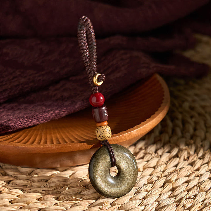 Schlüsselanhänger Goldobsidian Friedensschnalle handgeknüpft Holzperlen spirituelles Amulett Glücksbringer