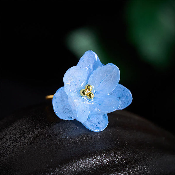 Ring Liuli Hortensie – Weisheit blauer Blüten-Stein Ring goldenes Zentrum