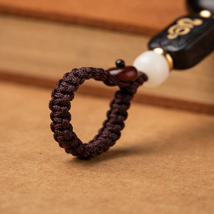Schlüsselanhänger Bodhi Lotus Ebenholz geflochten weiße Jade Glücksbringer spirituell