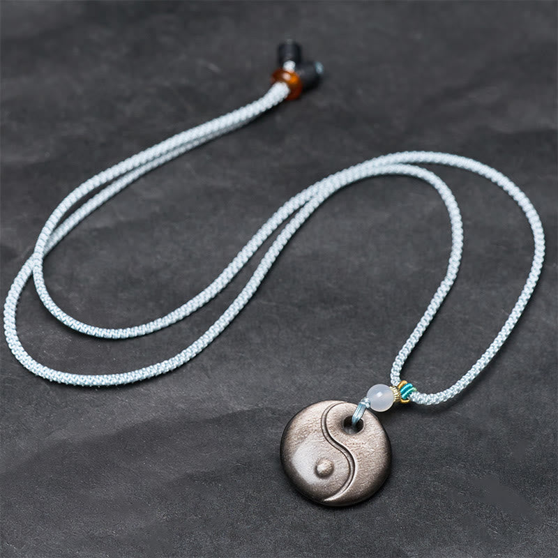 Obsidian Yin Yang Anhänger an weißer Kette Naturstein Schutz