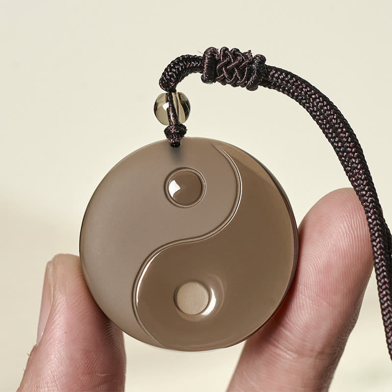 Yin Yang Anhänger Kette Obsidian braun Innere Stärke in Hand