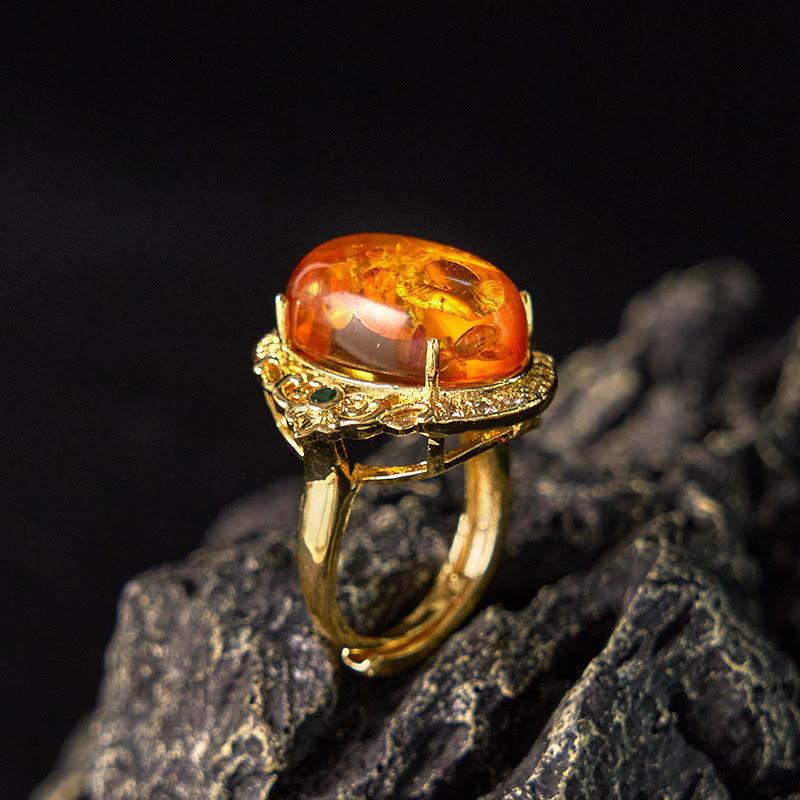 Bernsteinring Goldfassung Blumenmuster Luxus Schutzring Glück Klarheit