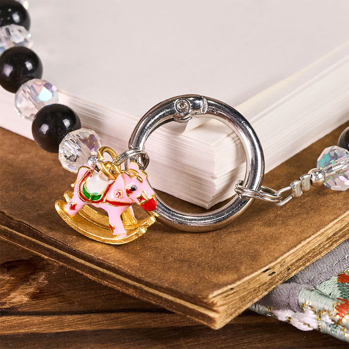 Schlüsselanhänger Pferd Obsidian Schutz Schaukelpferd rosa Glücksbringer spirituell Geschenk