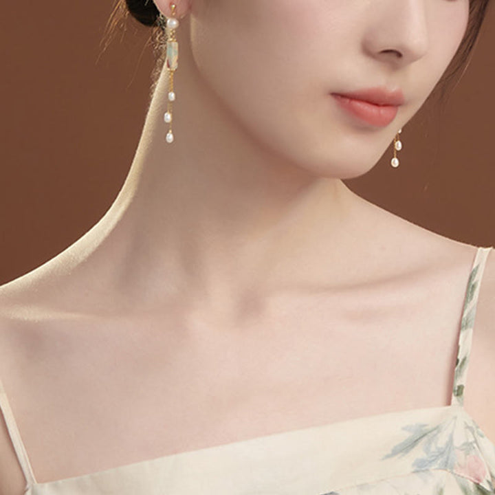 Ohrringe Shoushan-Stein Perle getragen Gold lange Quaste eleganter Boho Schmuck
