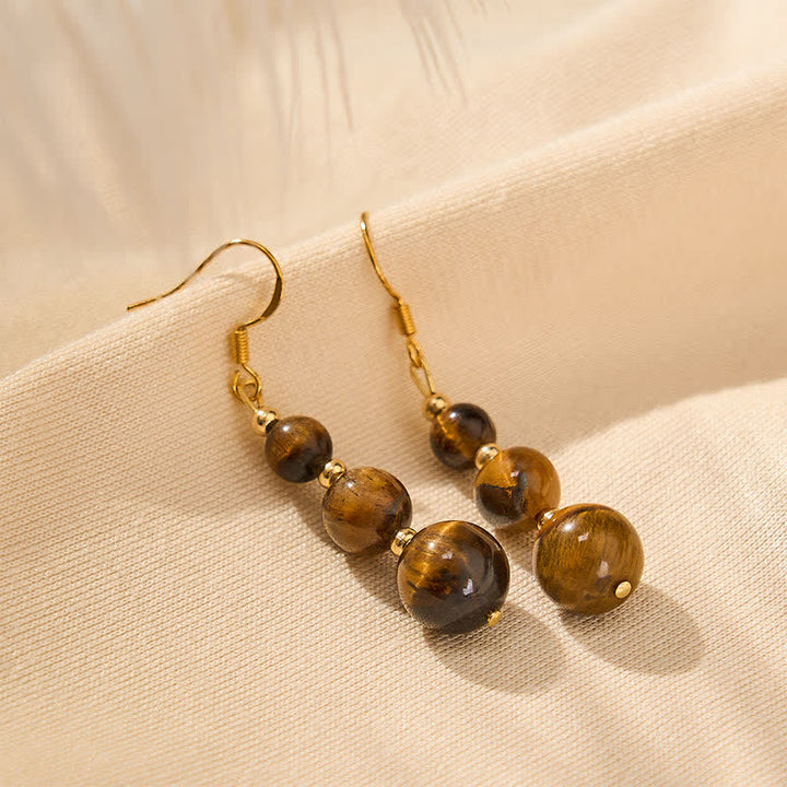 Ohrringe Tigerauge Perlen Stärke goldene Ohrhänger Boho Schmuck spirituell