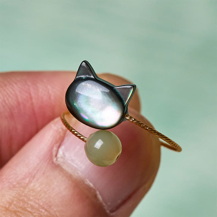 Schwarzer Tridacna Jade Katzenring mit grüner Perle Segen Glück