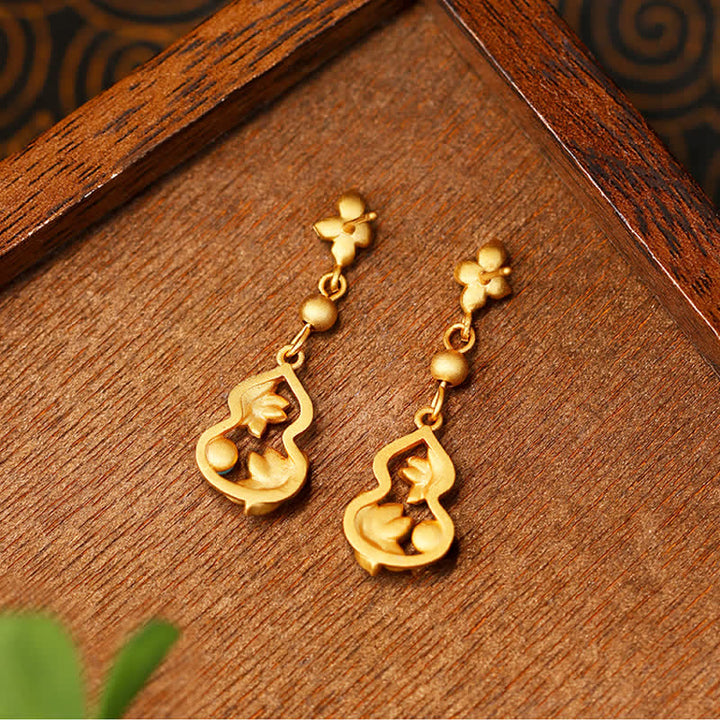Ohrringe Kürbis Lotus goldfarben Holz Boho Schmuck spirituelle Ohrhänger