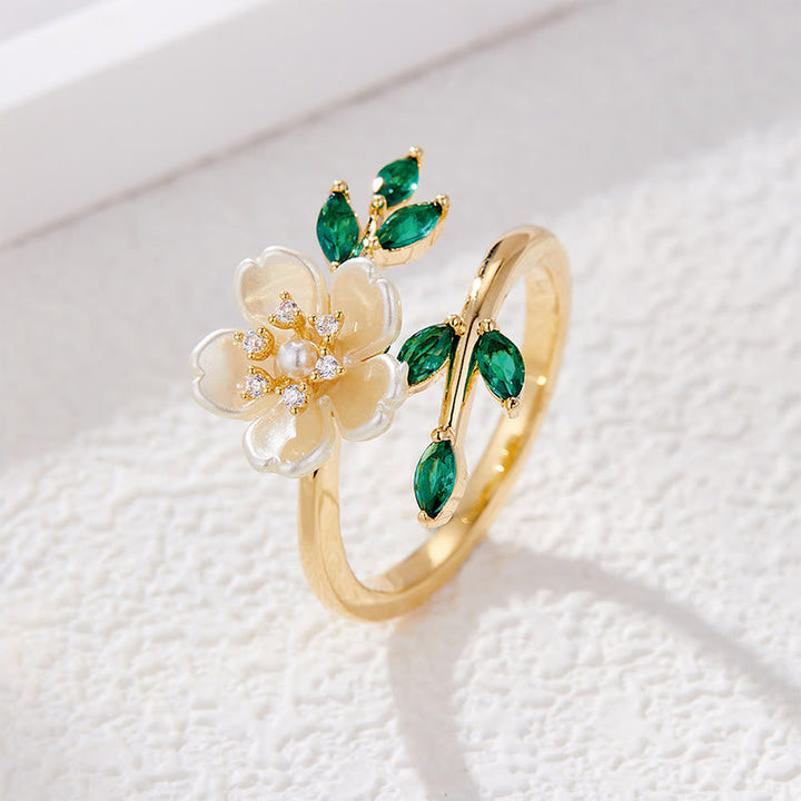 Goldring Blume Perlmutt grüne Zirkonia Glück Wohlstand elegant