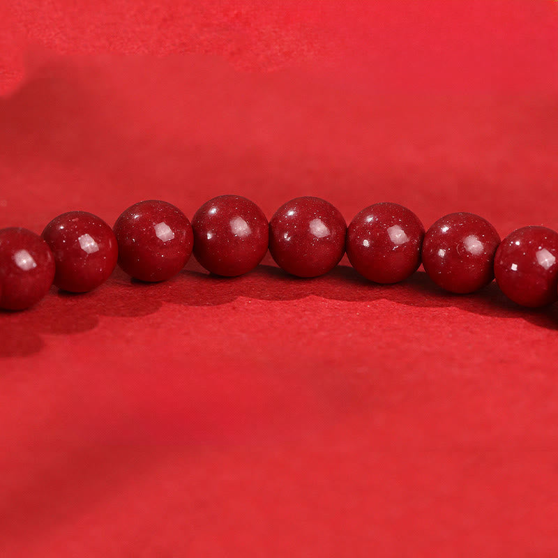 Armband 925 Silber Roter Achat Ruhe Perlen Detail auf rotem Stoff