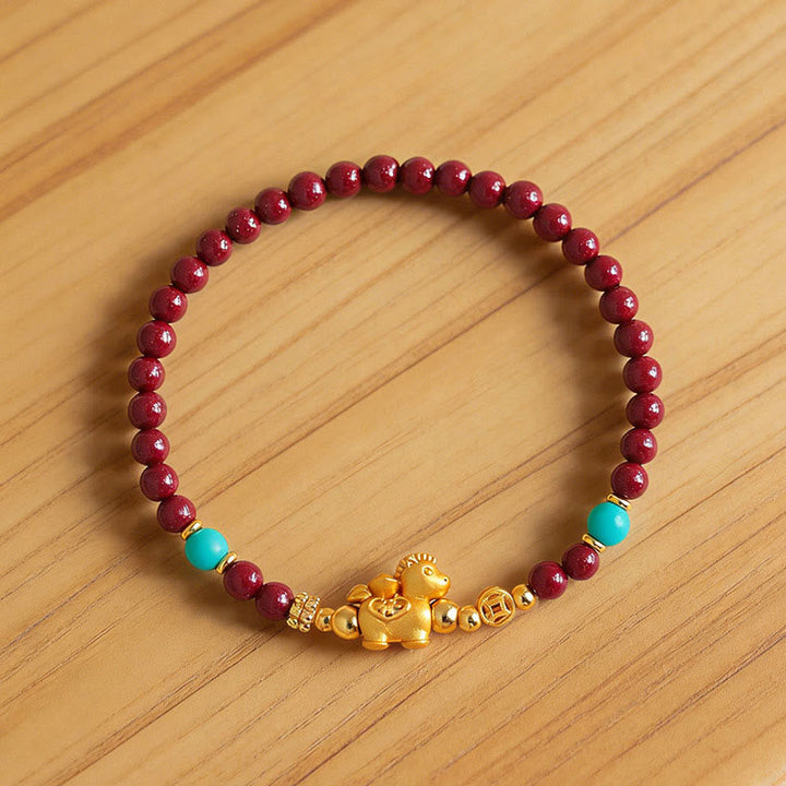 Armband Zinnober Fu-Zeichen Ruhe Energie rote Perlen Türkis goldenes Pferd
