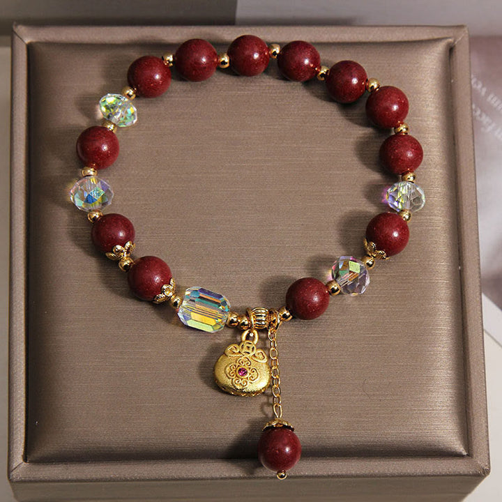 Armband Sandelholz Glück Heilung rote Perlen Kristalle goldener Anhänger Schmuckbox