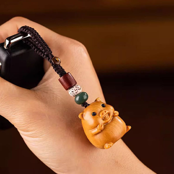 Schlüsselanhänger Sandelholz Bodhi Pferd Schwein Holz handgeschnitzt Glücksbringer spirituell