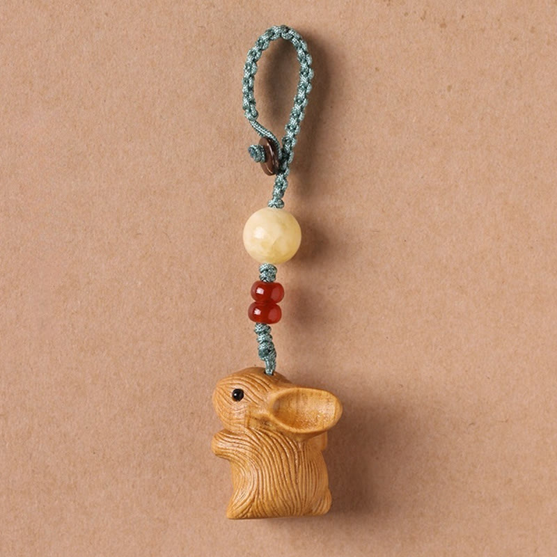 Schlüsselanhänger Hase Sandelholz Schutz handgeschnitzt Glücksbringer spirituell Naturholz