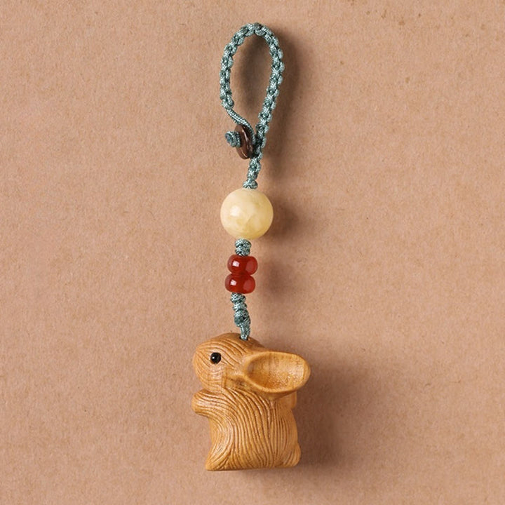 Schlüsselanhänger Hase Sandelholz Schutz handgeschnitzt Glücksbringer spirituell Naturholz