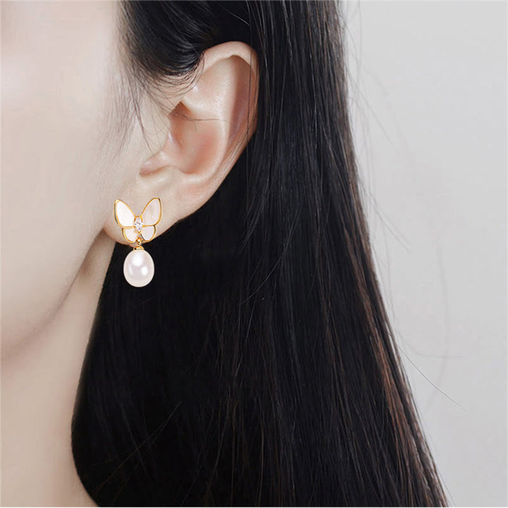 Ohrringe Perle Schmetterling Optimismus getragen Gold Boho Schmuck spirituell Ohrhänger