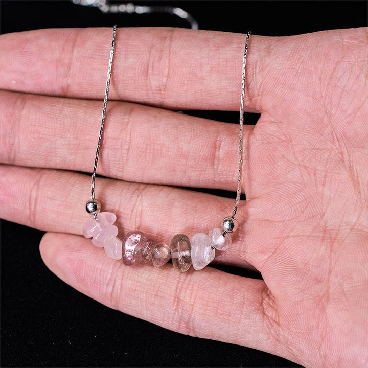 Rosenquarz Kette Heilstein Anhänger am Arm getragen Schwarzer Obsidian Stärke