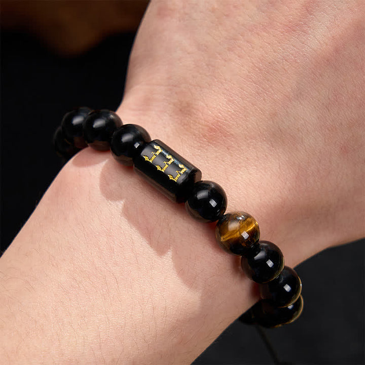 Armband Schwarzer Obsidian Tigerauge Stärke Segen am Handgelenk getragen Schutz