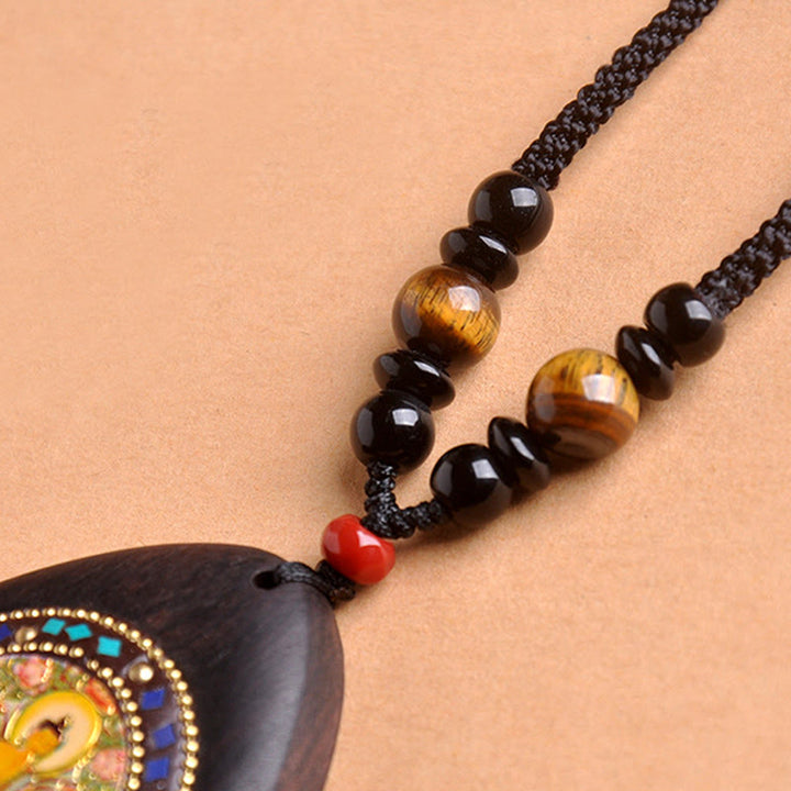 Schwarze Ebenholz Kette mit Tigerauge und schwarzem Onyx Anhänger