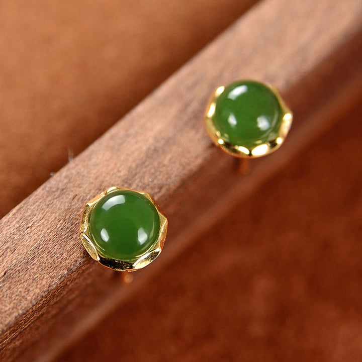 Ohrringe Hetian Jade Silber Glück grüne Edelstein Ohrstecker Holz Hintergrund