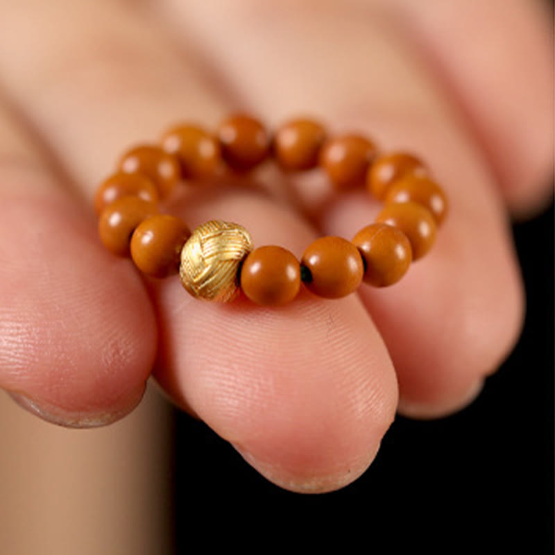 Ring Olivenkern Kupfermünze Stärke braun Perlen goldene Münze Schmuck