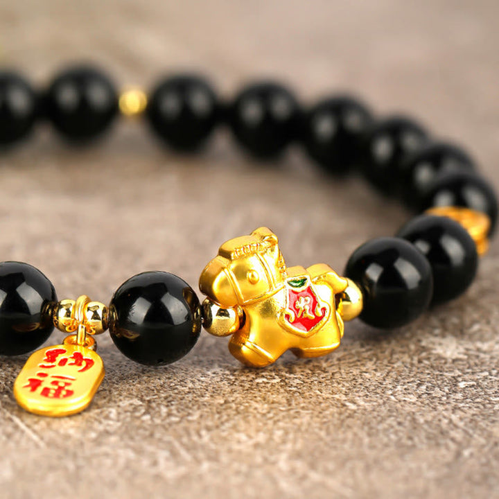 Armband Schwarzer Obsidian Stärke goldenes Pferd Anhänger Glücksbringer Handgelenk