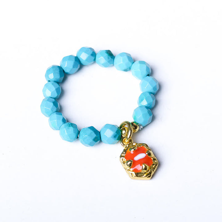 Türkis Ring Elastische Perle Armband roter Charm Anhänger Stärke