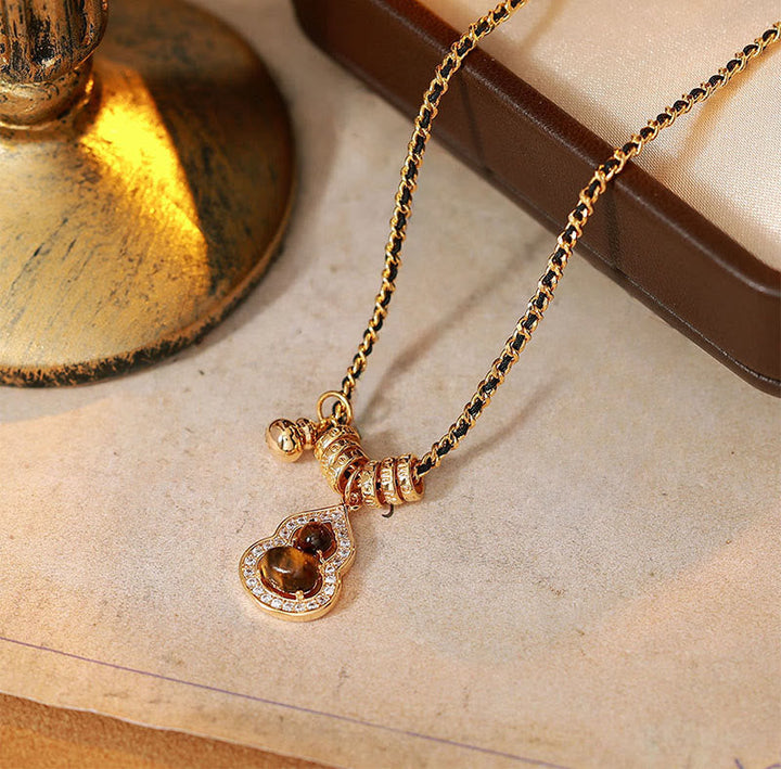 Elegante Kette Tigerauge Doppelkürbis Kupfer für Stärke und Schutz