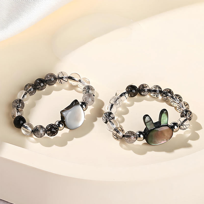 Zwei Rutilquarz Ringe mit Tridacna Hasen Katze Anhänger Design