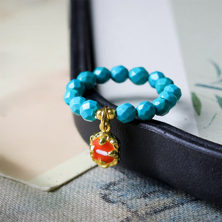 Ring Türkis Elastische Perlen Armband mit rotem Anhänger Stärke Schutz