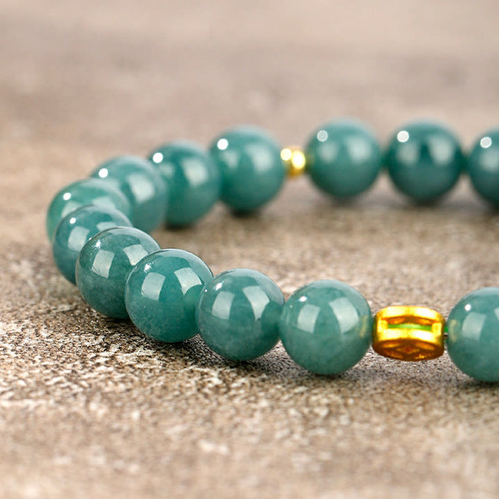 Armband Jade – Fülle & Wohlstand grüne Perlen goldene Akzente Naturstein